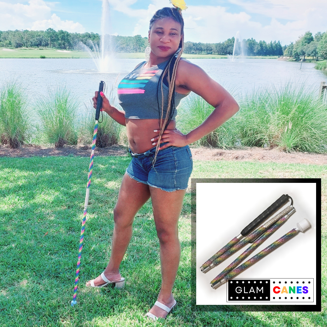 Lachi, a black woman with braids, poses holing a rainbow blind cane