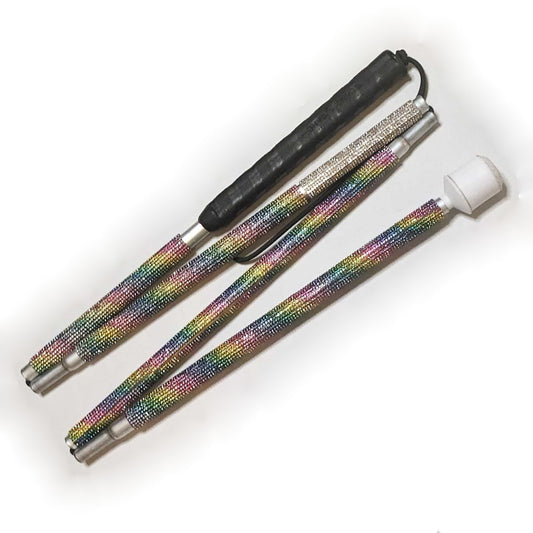 A blind cane designed with rhinestones in a spiraling rainbow pattern