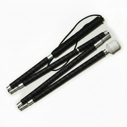 A blind cane designed with black rhinestones